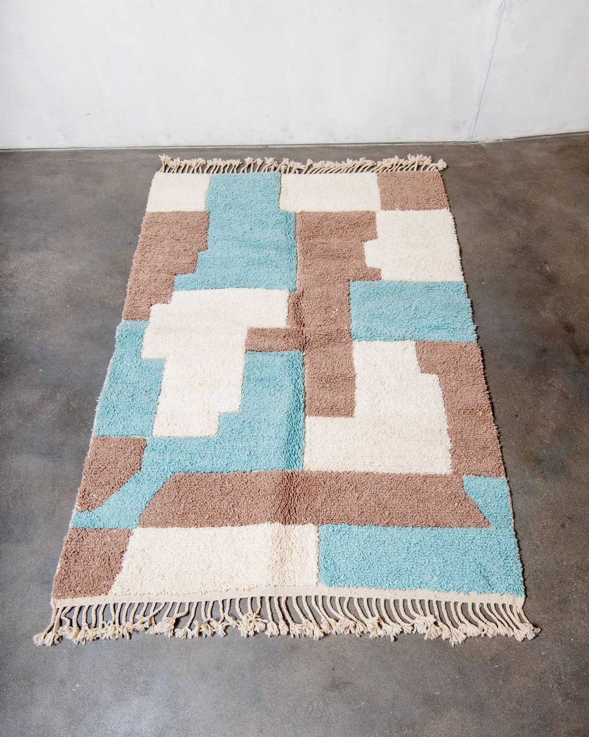 Modern, designer, handcrafted Berber rug from Morocco. Beniourain carpet with beautiful colours and patterns and fluffy wool texture.